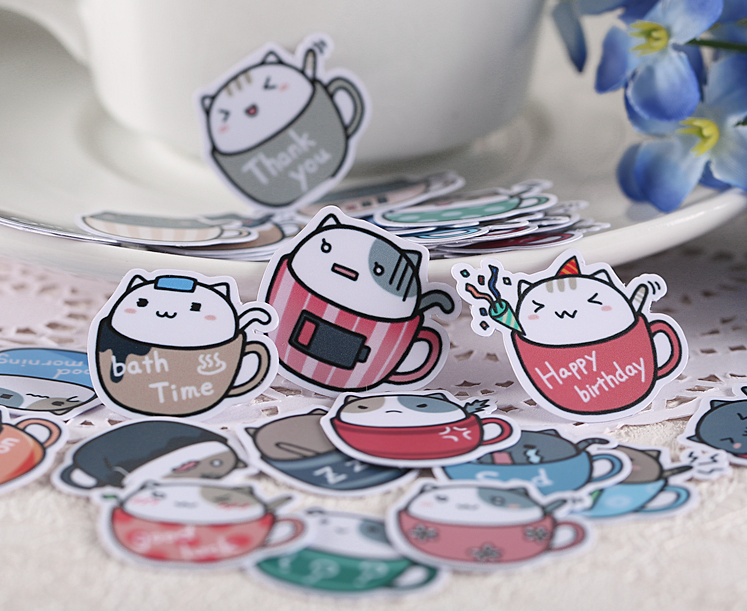 https://cutsyworld.com/cdn/shop/products/Cat-in-Cup-Stickers-3_2000x.png?v=1563126061